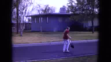 White Sands Florida (1970): Parent Walking With Child On A Street While Holding A