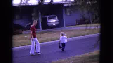 White Sands Florida (1970): Lady And Little Girl Walking Down Street In Front Of
