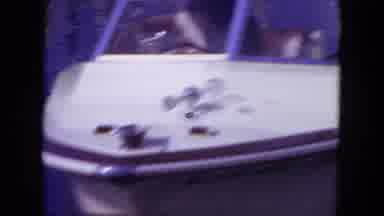 Mississippi (1971): Two Young People Riding White Speed Boat Across Lake While