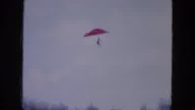 Mississippi (1971): A Person Flies Down On A Hang Glider Over A Lake