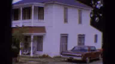 Diller Nebraska USA-1968: Camera Pans Across House And Classic Cars