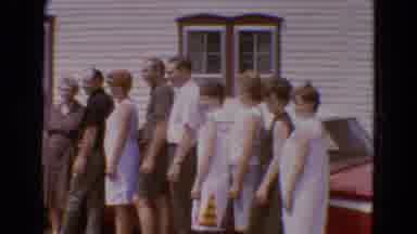 Diller Nebraska USA (1968): A Large Family Lined Up In Front Of A Red Car Parked
