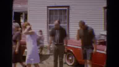Diller Nebraska USA (1968): People Standing Outside Of A House Next To Classic