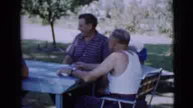 Clarksdale Arizona (1968): Adults Talking At A Table In A Garden While A Child