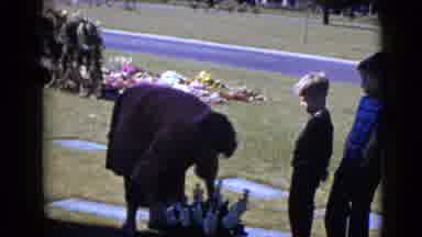 Clarksdale Arizona (1968): Lady Bending Down To Place Fresh Flowers Onto A Grave