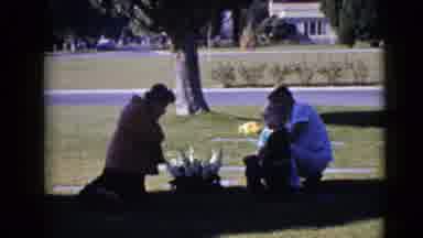 Clarksdale Arizona (1968): Woman Accompanied By Her Family Says Prayer Over A