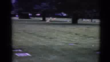 Clarksdale Arizona (1968): Older Woman Walking To Put A Pink Flower Arrangement