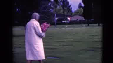 Clarksdale Arizona (1968): Woman Walking Through Cemetery With Arms Full Of