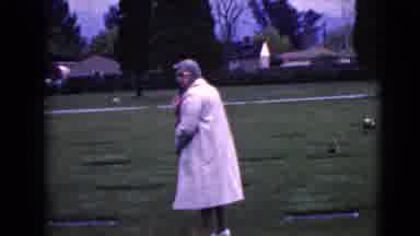 Clarksdale Arizona (1968): Old Woman Carrying A Bouquet Of Flowers And Examining