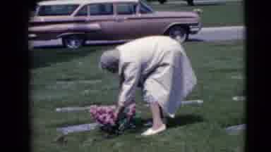 Clarksdale Arizona (1968): Woman Tending To Patch Of Pink Flowers In A Cemetery