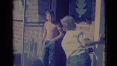 Clarksdale Arizona USA (1968): Little Boy Leaves House As Other Boy Jumps Up And