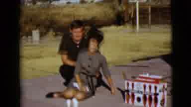 Clarksdale Arizona USA (1968): Women And Man Sit On The Ground As Their Dog Plays