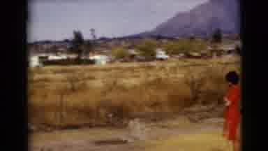 Clarksdale Arizona USA (1968): Girl On A Farm Is Watching A Little Child Run
