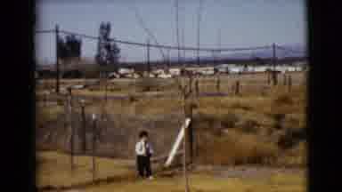 Clarksdale Arizona USA (1968): Woman Walking In Rural Area Towards Young Boy Near