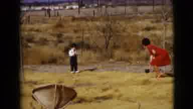 Clarksdale Arizona USA (1968): Small Boy And Woman Playing Catch With A Ball
