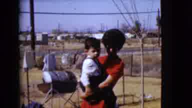 Clarksdale Arizona USA (1968): A Lady Holding A Baby And Other Boy Playing With