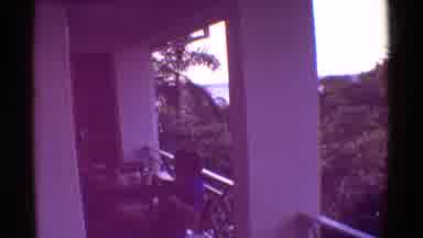 Mauna Ulu Hawaii (1971): Child Sitting On The Balcony Of A Building At A Table