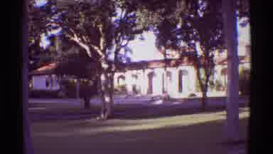 Mauna Ulu Hawaii (1971): A Beautiful View Of A House And Some Faraway Mountains