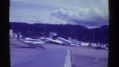 Mauna Ulu Hawaii (1971): Plane Taxis On The Runway As Another Is Towed Out Of The