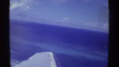 Mauna Ulu Hawaii (1971): The Ocean Along With The Wing Of A Plane Is Seen Out Of A