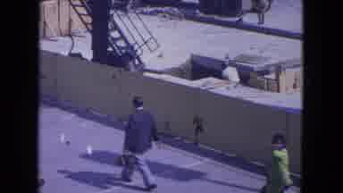 Ohare Chicago USA (1972): Group Of People Notice And Wave To Camera One Story