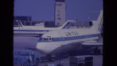 Ohare Chicago USA (1972): Station Wagon Drives Past United Airplane Traffic At