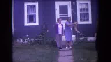 Lake Geneva Wisconsin USA (1972): Two Ladies Standing On Sidewalk In Front Of