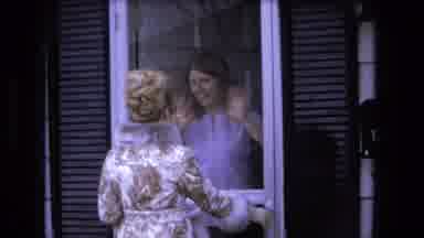 Fort Wayne Indiana (1973): Woman Wearing Blue Shirt Waves At Woman Wearing Tan