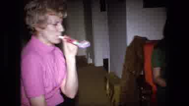 Fort Wayne Indiana (1973): Two Women Sitting In Chairs In Living Room Blowing Into