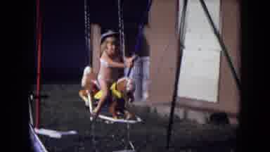 Gila National Forest New Mexico-1973: Girl Plays On Horse Swing In Backyard