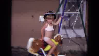 Gila National Forest New Mexico-1973: A Young Girl Swinging On A Rocking Horse
