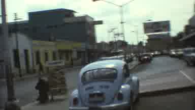 Mexico City (1973): A View Of An Old City Street With Cars Parked An Old Car