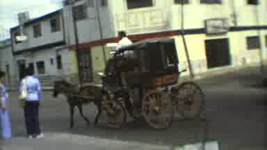Mexico City (1973): A Small Stagecoach Led By A Horse Pulls A Man Through A South