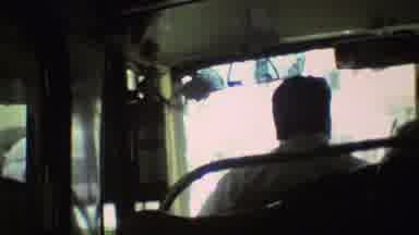 Mexico City (1973): A Bus Driver Navigates Down An Urban Street As A Passenger
