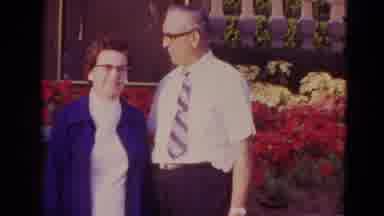 Orlando Florida USA (1974): Elderly Couple Pose With Flowers In Two Different