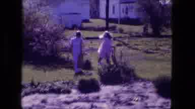 Fort Wayne Indiana (1974): Two Girls Roaming Around A Yard Looking For Things