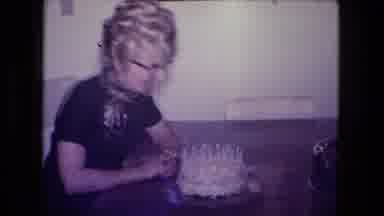 Fort Wayne Indiana (1974): Woman Excitedly Blowing Out Candles On A Birthday Cake