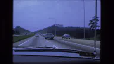 Fort Wayne Indiana (1974): Driving On An Interstate Near Major Hotels During A