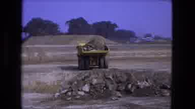 Fort Wayne Indiana (1974): Dumper Truck Tips Large Load Of Dirt Into Pre-Dug Hole