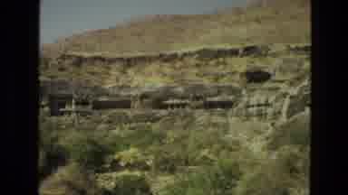 India (1974): View Of Caves In Brown Hills On A Sunny Day