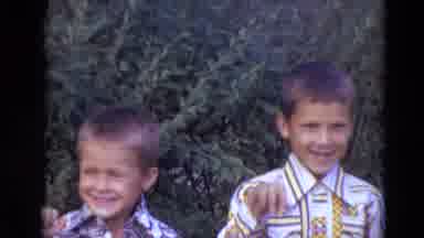 Lincoln Nebraska-1974: Siblings Waving Joyfully In Matching Shirts