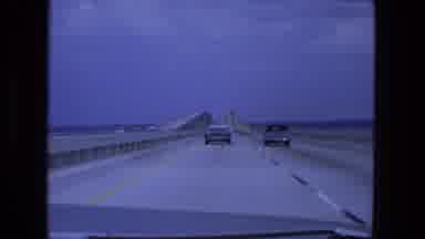 Fort Wayne Indiana (1974): Following Cars On The Highway As They Pass By The Ocean