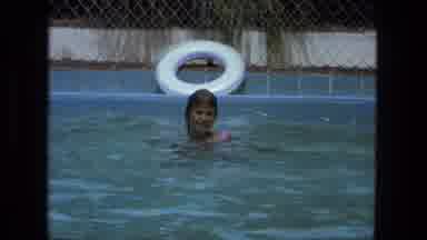Fort Wayne Indiana (1974): Young Girl Splashing As She Swims In The Clear Waters