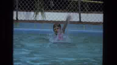 Fort Wayne Indiana (1974): Little Boy Plays In The Pool And Splashes The Water