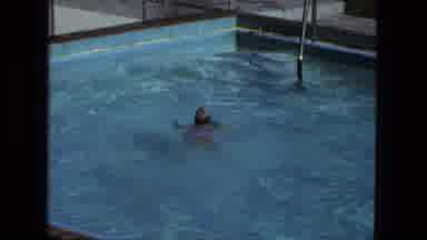 Fort Wayne Indiana (1974): A Girl Swims In A Fenced In Pool Near The Pool Stairs