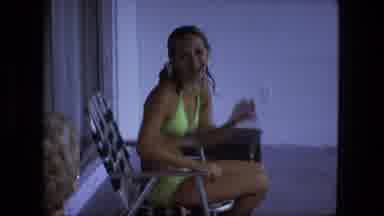 Fort Wayne Indiana (1974): Woman Sitting In Chair Talking Wearing Bathing Suit