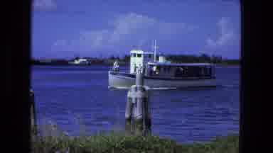 Fort Wayne Indiana (1974): A Small Yacht Glides Along A River Followed By A Splash