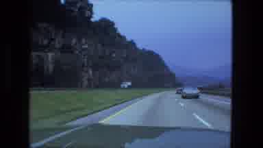 Fort Wayne Indiana (1974): Road Trip Down Two Lane Highway Past Lake And Mountain