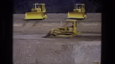 Fort Wayne Indiana (1974): Yellow Tractor Pushing Dirt Around In A Big Open Area