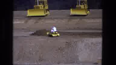 Fort Wayne Indiana (1974): Three Yellow Full Sized Bulldozers Roll On Sand With